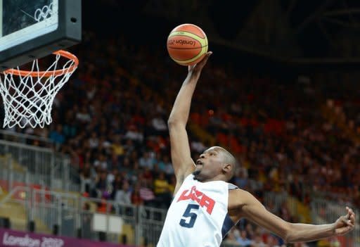 US forward Kevin Durant shoots during the Men's Preliminary Round Group A match United States vs France at the London 2012 Olympic Games in London. With US First Lady Michelle Obama and a host of top US Olympic athletes watching them, the American collection of NBA stars sent a message to Olympic rivals -- we're ready for you