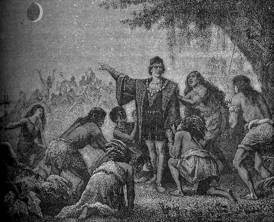 An illustration depicts explorer Christopher Columbus predicting a lunar eclipse to locals in Jamaica.