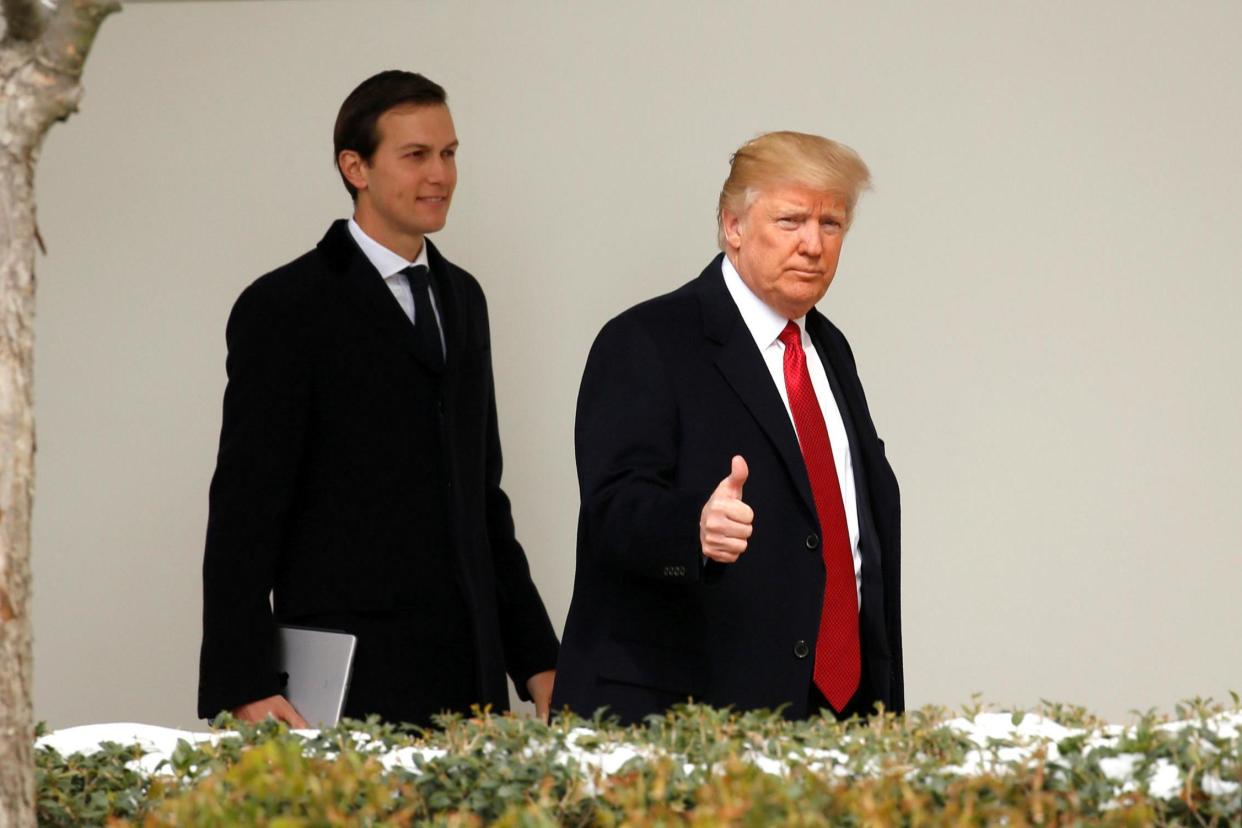 Probe: Donald Trump gives a thumbs-up as he and Jared Kushner leave the White House: REUTERS