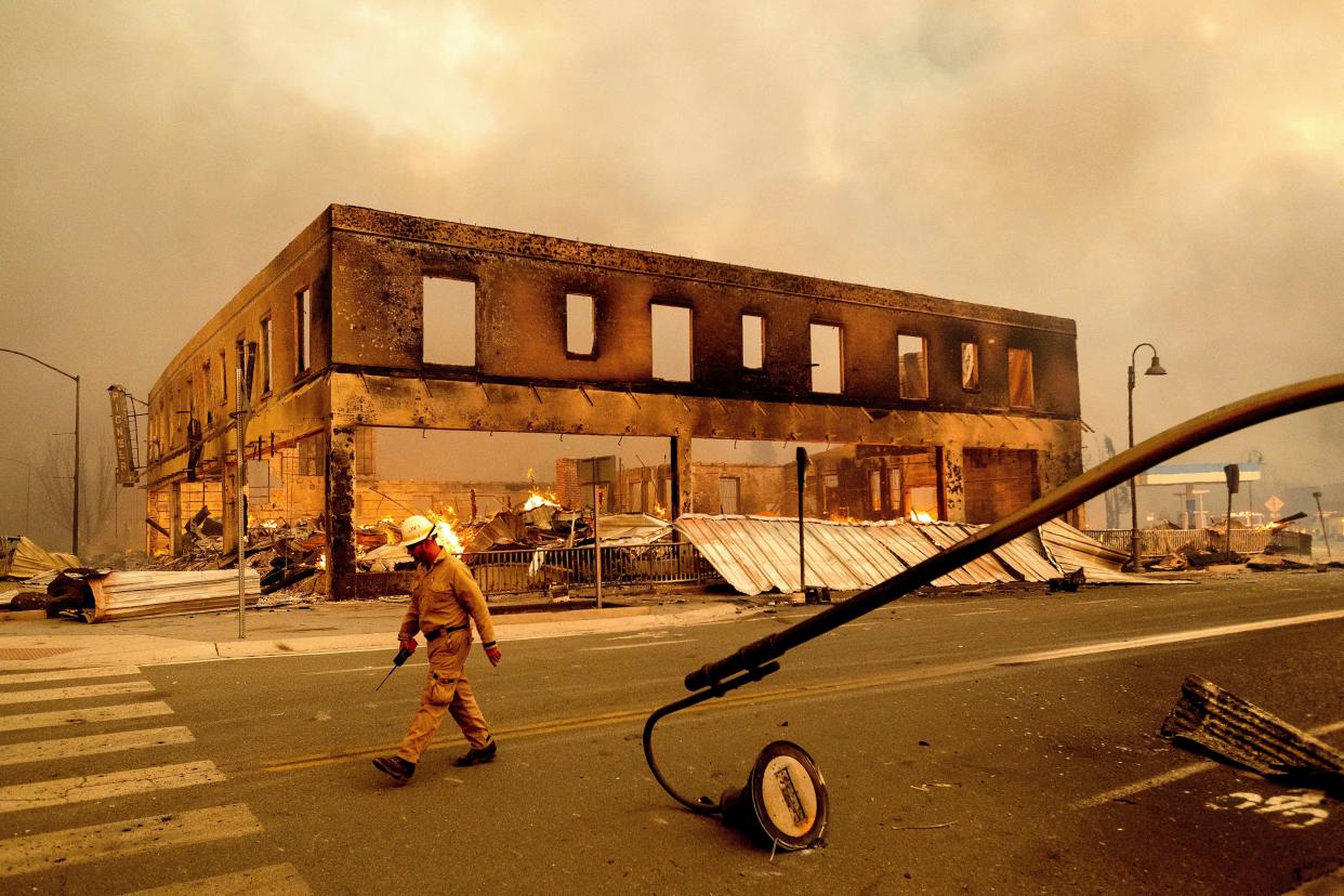 Operations Chief Jay Walter passes the historic Sierra Lodge as the Dixie Fire burns through the Greenville community of Plumas County, Calif. on Wednesday, Aug. 4, 2021.