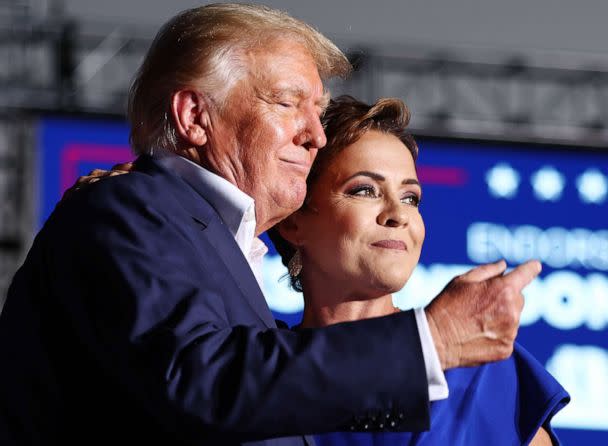 PHOTO: Former President Donald Trump embraces Arizona Republican nominee for governor Kari Lake, who he has endorsed, during a campaign rally at Legacy Sports USA on Oct. 9, 2022 in Mesa, Ariz. (Mario Tama/Getty Images)