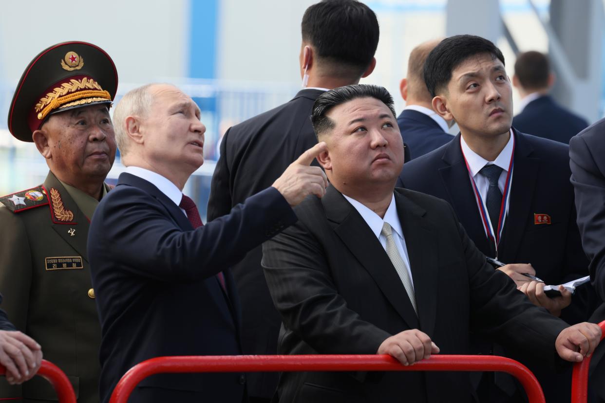 Russian President Vladimir Putin and North Korea’s leader Kim Jong Un examine a launch pad during their meeting at the Vostochny cosmodrome (AP)
