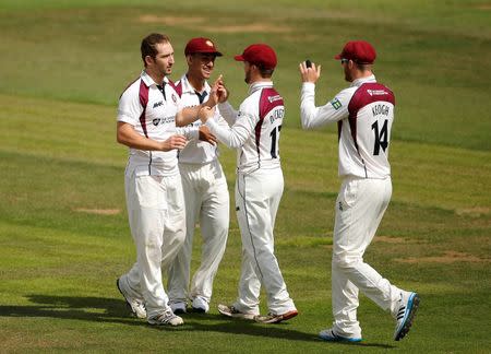 Cricket - Northamptonshire v Australia - County Ground, Northampton - 16/8/15 Northamptonshire's Steven Crook (L) celebrates the wicket of Australia's Adam Voges (not pictured) Action Images via Reuters / Paul Childs Livepic