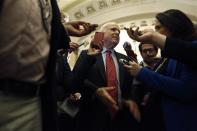 U.S. Senator John McCain (R-AZ) talks to reporters after a Republican Senate caucus meeting at the U.S. Capitol in Washington, October 16, 2013. REUTERS/Jonathan Ernst