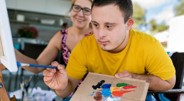 Teen with Down Syndrome painting 