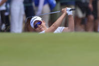 South Korea's Jiyai Shin plays out of the bunker on the first hole during the Australian Open golf championship at Victoria golf course in Melbourne, Australia, Saturday, Dec. 3, 2022. (AP Photo/Asanka Brendon Ratnayake)