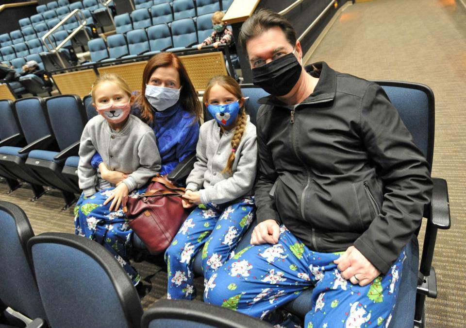 Wearing matching pajama bottoms are the Martin family, of Scituate: from left, Ella, 7, mom Ellen, Ella's twin sister, Nora, and dad Doug. They were at the Scituate North Pole Express Movie Experience presented by the Community of Resources for Special Education Foundation at the Scituate Center for Performing Arts on Saturday, Dec. 4, 2021.