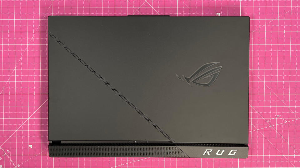 An Asus ROG Strix Scar 17 (2023) on a desk with a pink desk mat