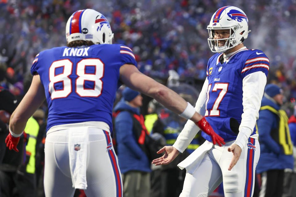 Buffalo Bills quarterback Josh Allen (17) and tight end Dawson Knox (88) celebrate after a touchdown against the Pittsburgh Steelers during the first quarter of an NFL wild-card playoff football game, Monday, Jan. 15, 2024, in Buffalo, N.Y. (AP Photo/Jeffrey T. Barnes)