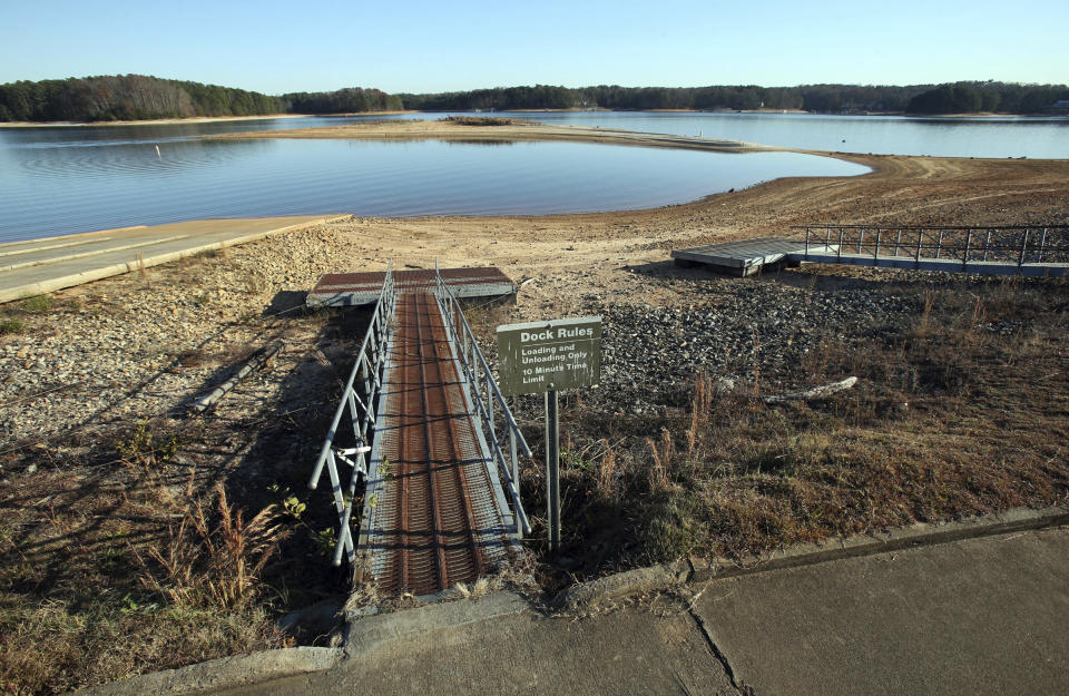 Floating docks rest on dry land far from the water as they are closed due to low water levels on Lake Lanier at Mary Alice Park in Cumming, Ga., Monday, Nov. 26, 2012. Mary Alice Park is a Corps of Engineers Park whose boat ramp and floating docks are closed due to low water levels. Lake Lanier is at its lowest level since the historic drought of several years ago, when lakeside businesses lost millions in recreation revenue and boaters were unable to launch their crafts. Monday's level was 1,058 feet above sea level, 13 feet below full pool. The last time Lake Lanier was at that level was in March 2009, the last days of the two-year drought that ravaged the state. (Jason Getz/Atlanta Journal-Constitution via AP)