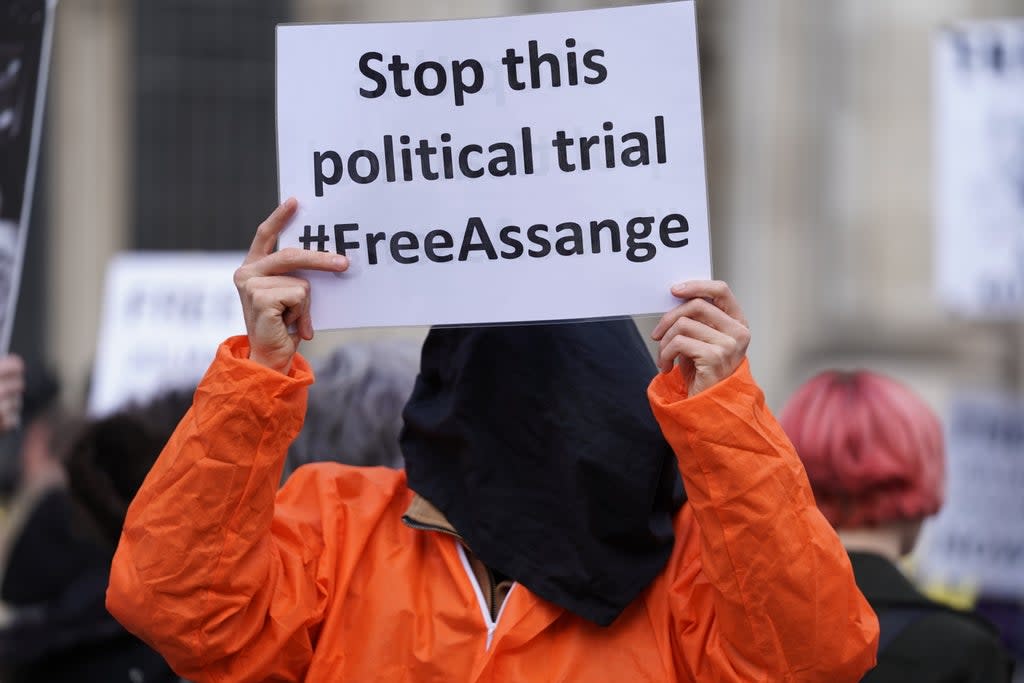 A protester outside the High Court in London, ahead of a hearing in the US government’s legal challenge over a judge’s decision not to extradite Wikileaks founder Julian Assange (Kirsty O’Connor/PA) (PA Wire)