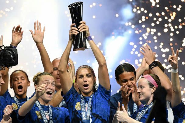 PHOTO: Alex Morgan raises the SheBelieves Cup trophy as the United States Women's National Soccer Team celebrates following the 2023 SheBelieves Cup soccer match between the United States and Brazil at Toyota Stadium in Frisco, Texas, Feb. 22, 2023. (Patrick T. Fallon/AFP via Getty Images)