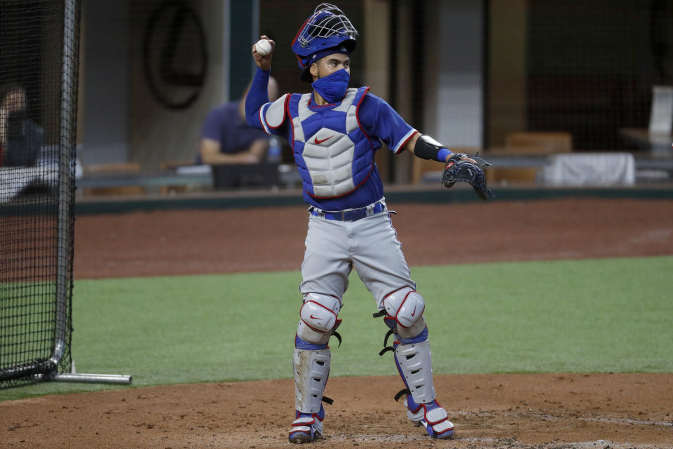 Texas Rangers catcher Robinson Chirinos throws to the mound during an intrasquad game during baseball practice in Arlington, Texas, Thursday, July 9, 2020. (AP Photo/Tony Gutierrez)