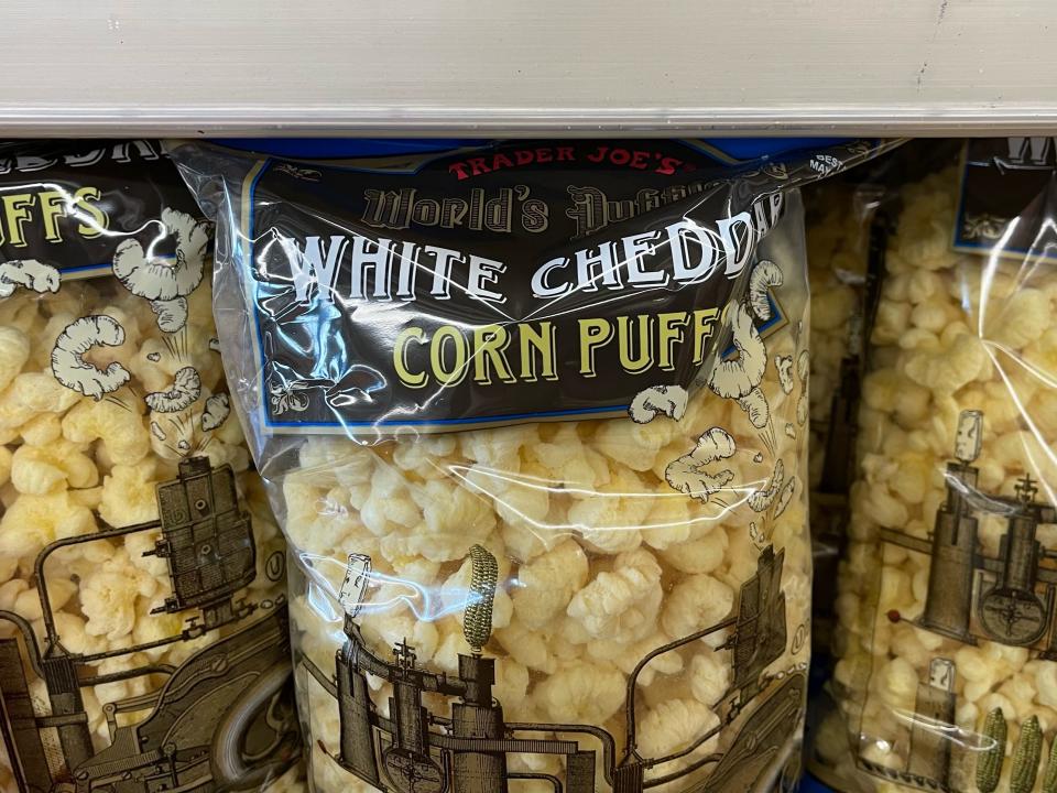 World's Puffiest white-cheddar corn puffs on a shelf