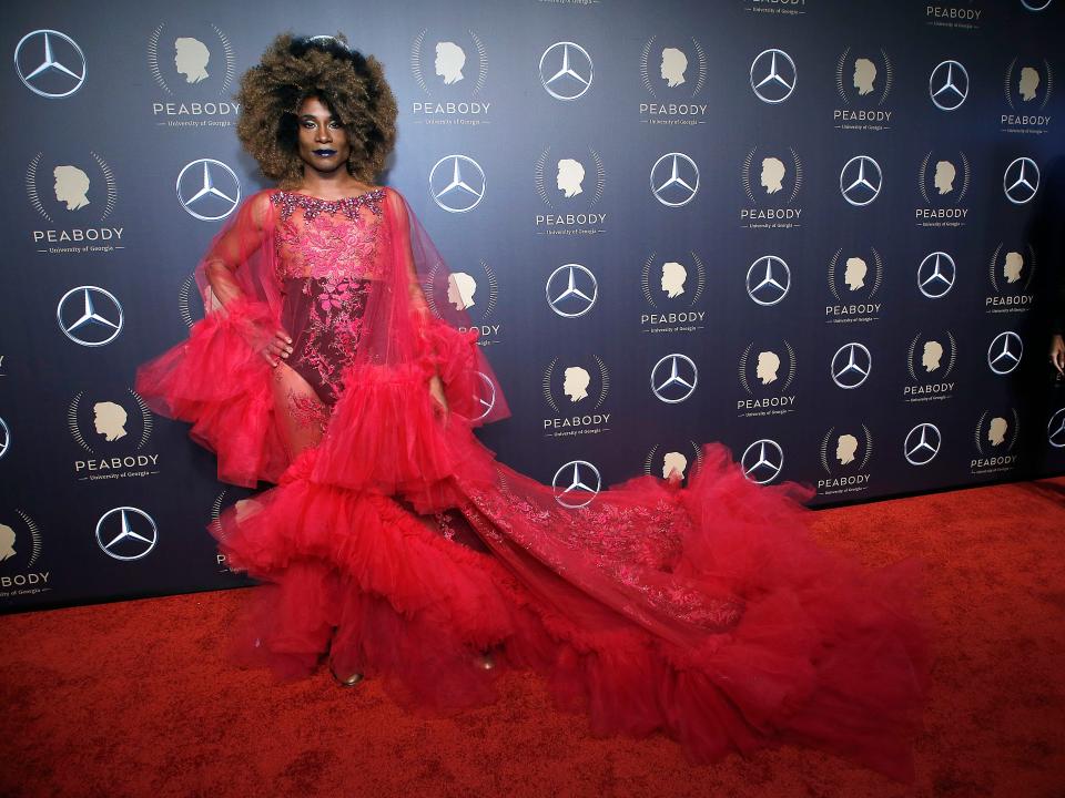Billy Porter at the 2019 Peabody Awards in red gown