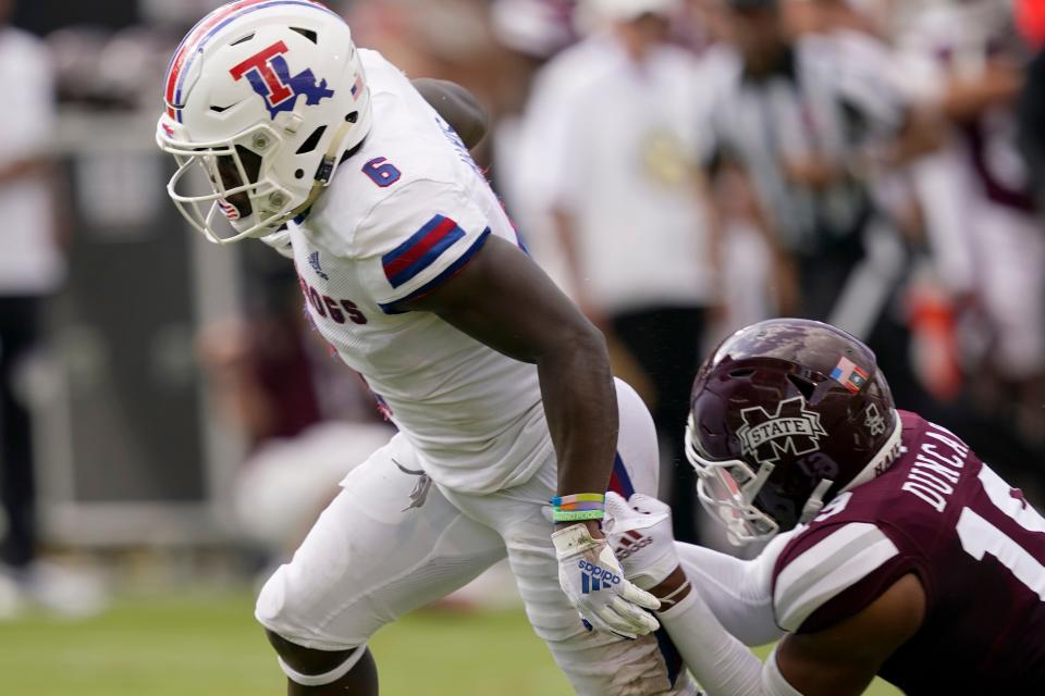 Louisiana Tech wide receiver Smoke Harris (6) breaks away from Mississippi State safety Collin Duncan (19) as he rushes forward with a touchdown pass reception during a game Sept. 4, 2021, in Starkville, Miss.