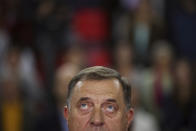 Serb member of the Bosnian Presidency Milorad Dodik listens to the anthem of Alliance of Independent Social Democrats (SNSD) during campaign rally in Istocno Sarajevo, Bosnia, Tuesday, Sept. 27, 2022. Bosnia and Herzegovina will hold a general election on Oct. 2. (AP Photo/Armin Durgut)