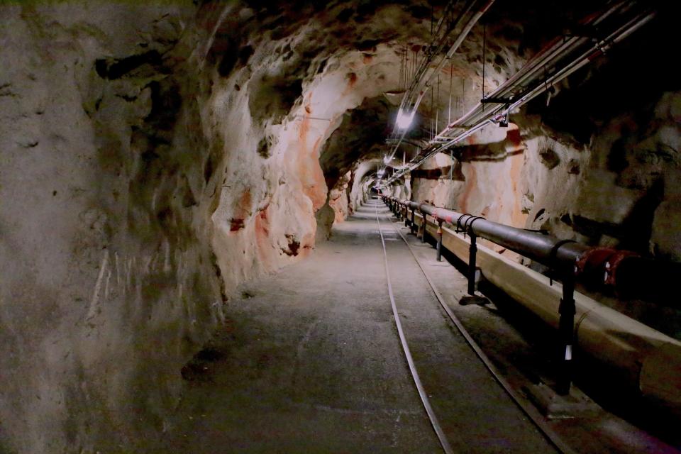 FILE - Overhead lights illuminate a tunnel inside the Red Hill Underground Fuel Storage Facility in Pearl Harbor, Hawaii, on Jan. 26, 2018. A Navy investigation released Thursday, June 30, 2022 revealed that shoddy management and human error caused fuel to leak into Pearl Harbor's tap water last year, poisoning thousands of people and forcing military families to evacuate their homes for hotels. The investigation is the first detailed account of how jet fuel from the Red Hill Bulk Fuel Storage Facility, a massive World War II-era military-fun tank farm in the hills above Pearl Harbor, leaked into a well that supplied water to housing and offices in and around Pearl Harbor. (U.S. Navy via AP, File)