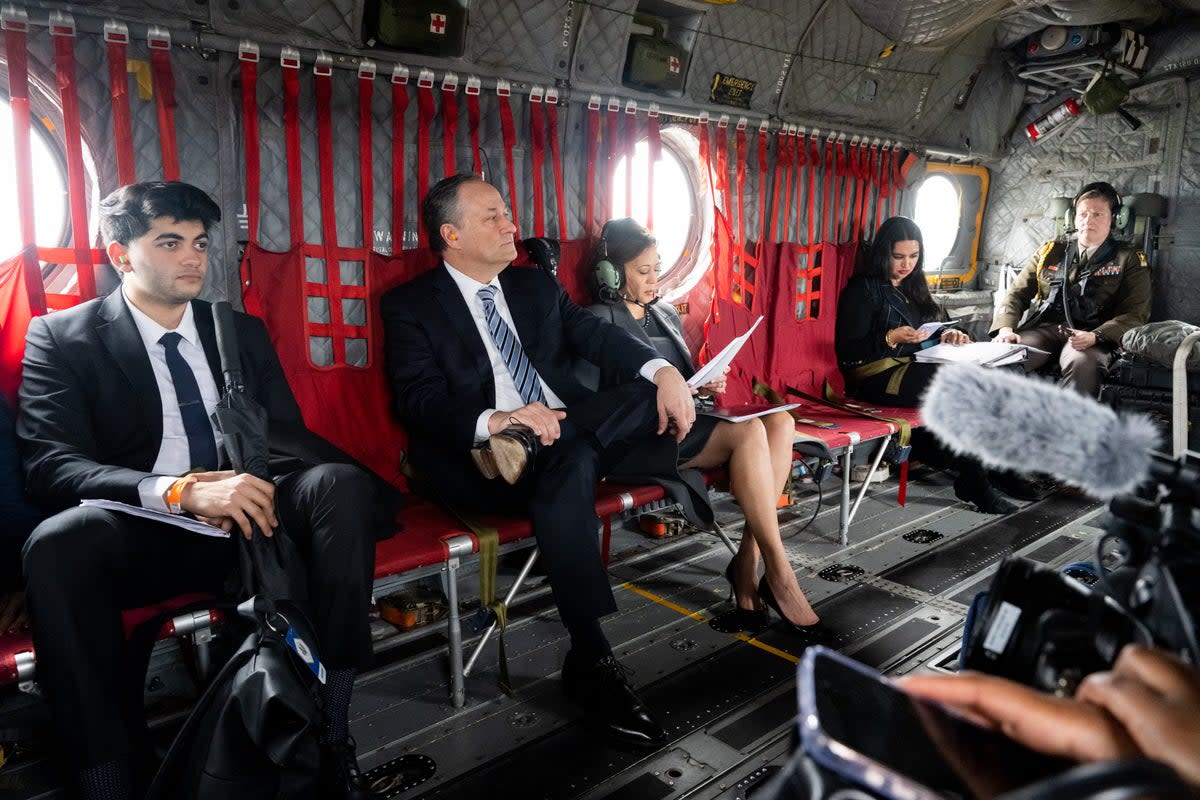 Kamala Harris reviews paperwork alongside her husband Doug Emhoff as they travel via army helicopter to Selma, Alabama, to commemorate the 59th anniversary of Bloody Sunday earlier this year (AFP via Getty Images)