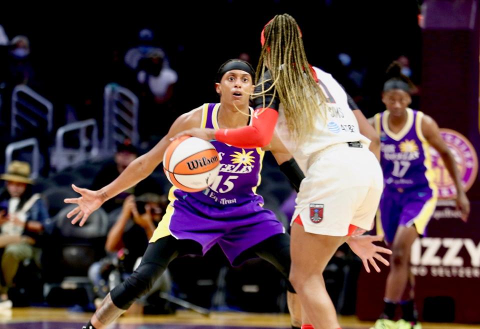 Sparks' Britney Sykes defends against Atlanta Dream guard Odyssey Sims.