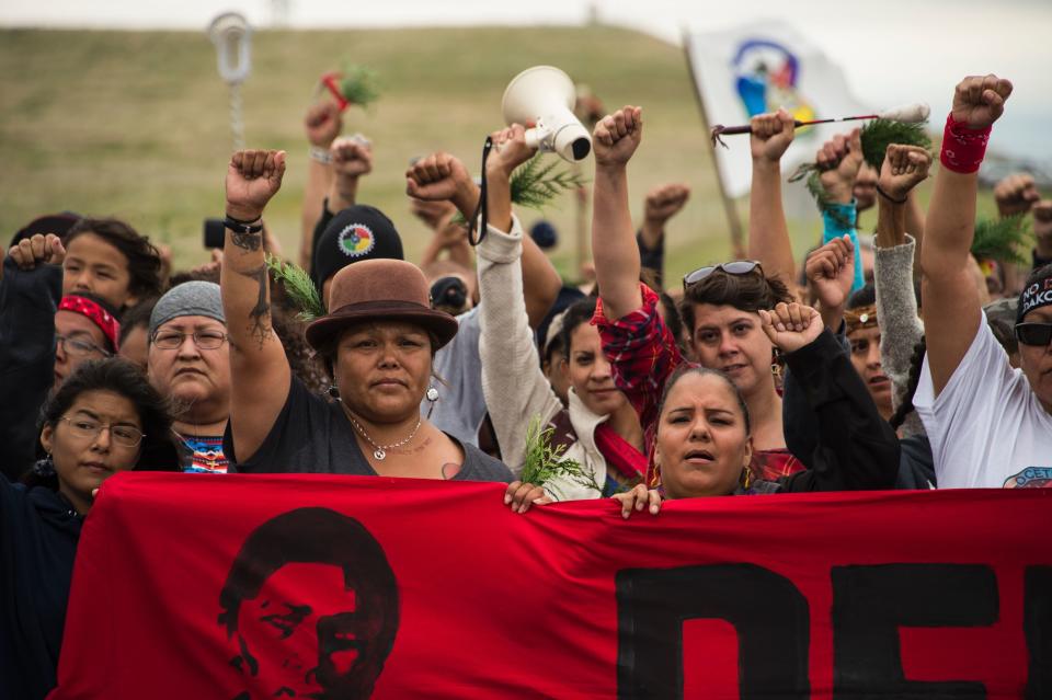 Native Americans march to a burial ground sacred site that was disturbed by bulldozers building the Dakota Access Pipeline (DAPL).