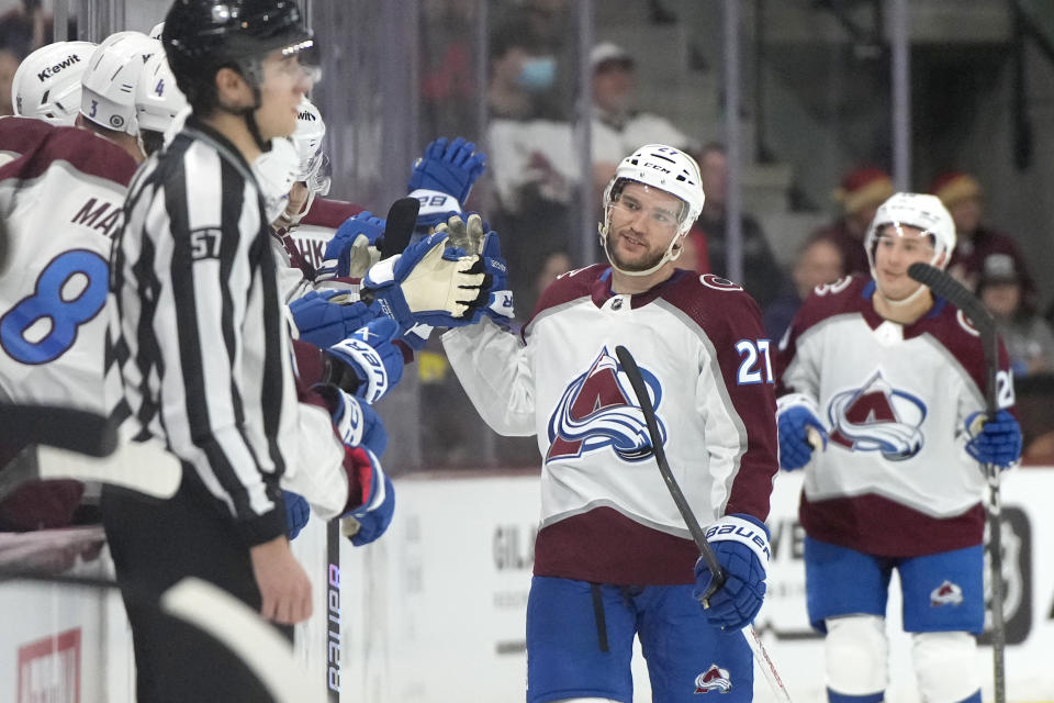 Colorado Avalanche left wing Jonathan Drouin (27) celebrates with teammates after scoring a goal against the Arizona Coyotes in the second period during an NHL hockey game, Wednesday, Dec. 27, 2023, in Tempe, Ariz. (AP Photo/Rick Scuteri)