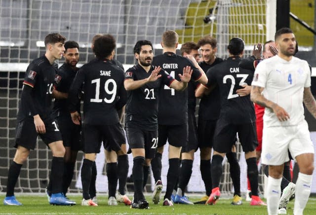 Germany’s players celebrate after Leon Goretzka scored their opening goal against Iceland