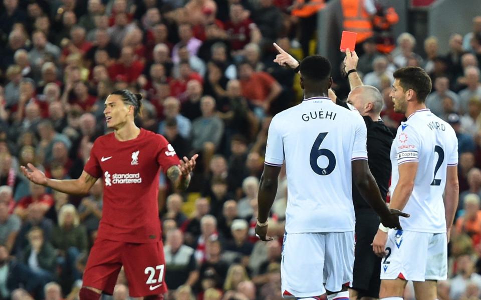Liverpool's Darwin Nunez is shown a red card by referee Paul Tierney - Reuters