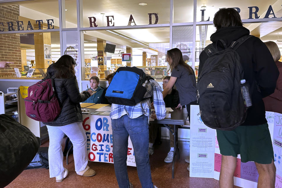 Brattleboro Union High School students register to vote during a voter drive at the school, Feb. 14, 2024, in Brattleboro, Vt. Sixteen and 17-year-olds in Brattleboro will get to vote in local elections and if they're 18 by the November general election they can cast ballots in the Super Tuesday presidential primary. (AP Photo/Lisa Rathke)