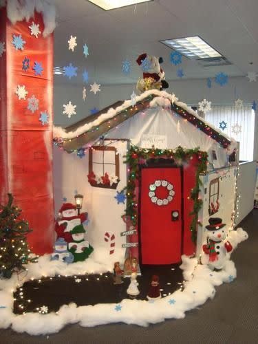 <p>This worker went all out - turning their cubicle into a Christmassy house complete with red front door.</p>