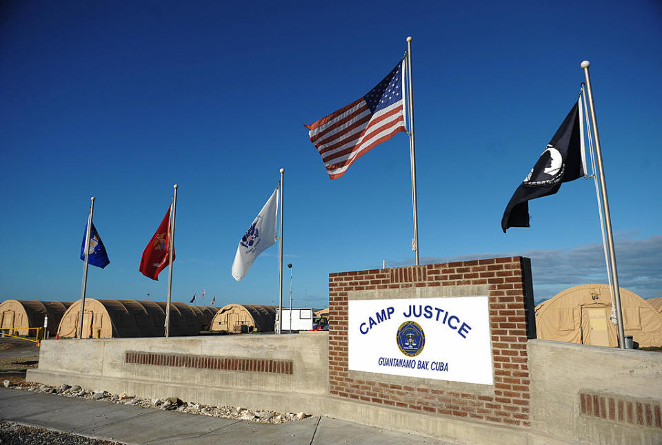 An image reviewed by the US military shows a "Camp Justice" sign near the  high-tech, high-security courtroom which will hold the pre-trial sessions for Khalid Sheikh Mohammed and his four co-defendants on charges related to the 9/11 attacks at "Camp Justice" in Guantanamo Bay December 8, 2008. Khalid Sheikh Mohammed, the alleged mastermind of the September 11, 2001 attacks, is set to appear Monday before a US military tribunal where he will face victims' kin for the first time. AFP PHOTO/Mandel NGAN/POOL (Photo credit should read MANDEL NGAN/AFP/Getty Images)