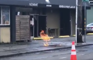 <p>A gas leak sends flames shooting through the pavement in Seattle.</p> (Twitter / Seattle Fire Department)