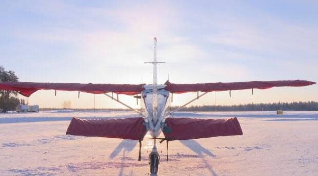 A plane at the Fort Smith Airport in January. Transport Canada is providing more than $15 million for work at that facility, with additional money for the Fort Simpson and Yellowknife airports. (Anna Desmarais/CBC - image credit)