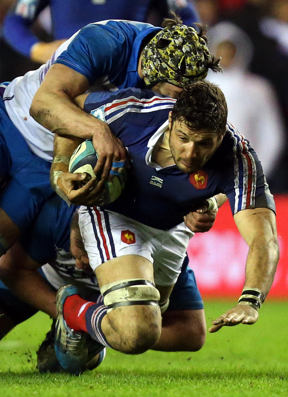 Scotland's Kelly Brown, left, tackles France's Damien Chouly, right, during their Six Nations rugby union international match at Murrayfield in Edinburgh, Scotland, Saturday March 8, 2014. (AP Photo/Scott Heppell)