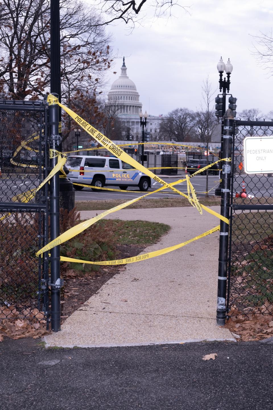 Police tape blocks off one of the many restricted zones around the Capitol.