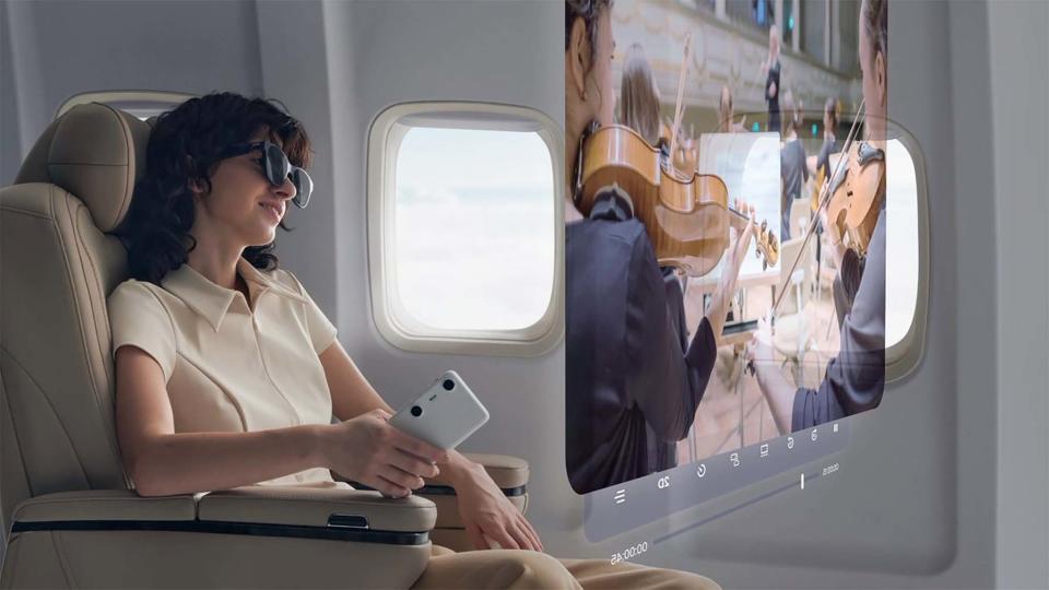 Person wearing XREAL glasses and using Beam Pro on a plane.