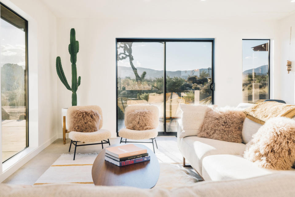 A living room with soft furnishings