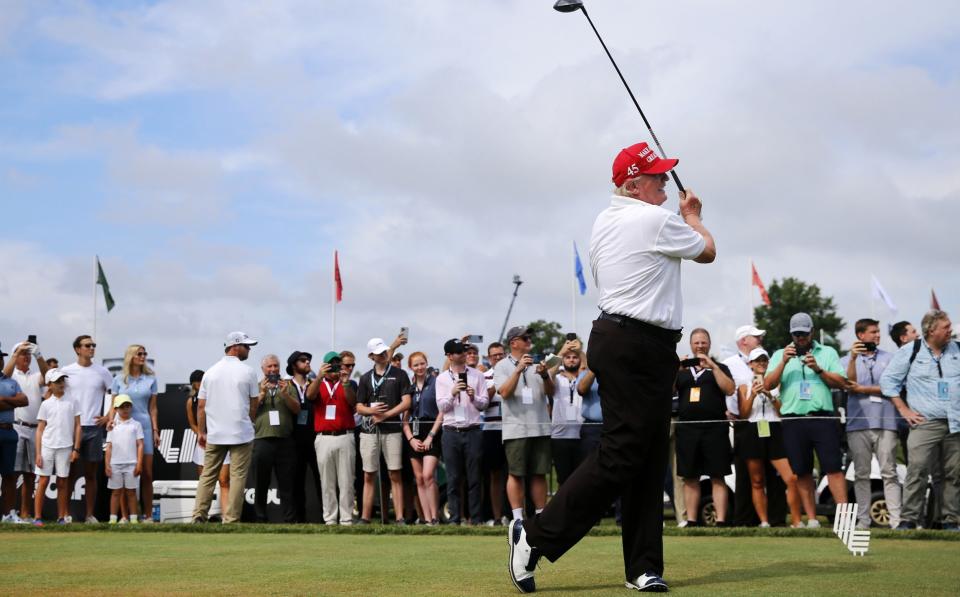 Donald Trump hits his opening tee-shot straight and true - GETTY IMAGES
