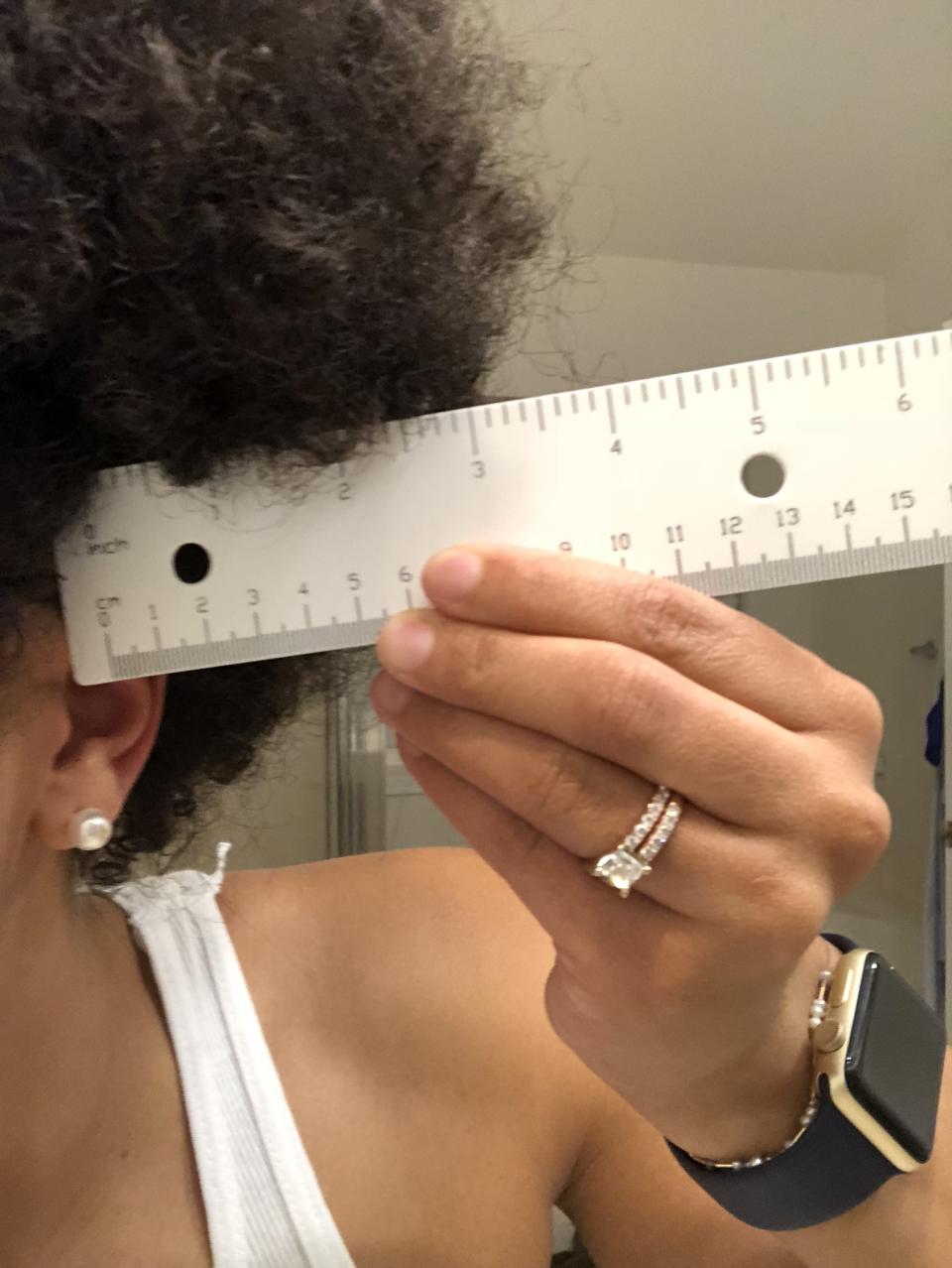 The nursing student measured her hair to prove that it met the school’s guidelines. (Photo: Courtesy of Jade Payadue)