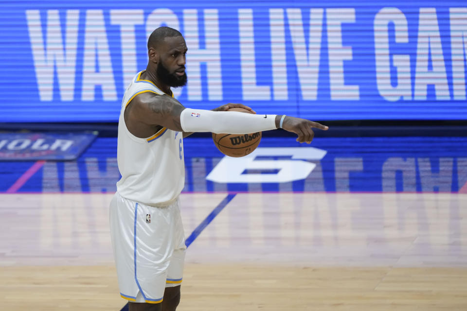 Los Angeles Lakers forward LeBron James moves the ball up court in the second half of an NBA basketball game against the New Orleans Pelicans in New Orleans, Saturday, Feb. 4, 2023. The Pelicans won 121-136. (AP Photo/Gerald Herbert)