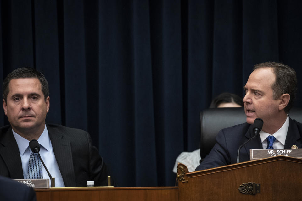 WASHINGTON, DC - MARCH 28: (L-R) U.S. House Select Committee on Intelligence ranking member Devin Nunes (R-CA) looks on as committee Chairman Adam Schiff (D-CA) responds to Republican calls for him to resign as chairman at a hearing concerning 2016 Russian interference tactics in the U.S. elections, in the Rayburn House Office Building, March 28, 2019 in Washington, DC. Every Republican on the committee signed the letter on Thursday demanding that Schiff step down.  (Photo by Drew Angerer/Getty Images)