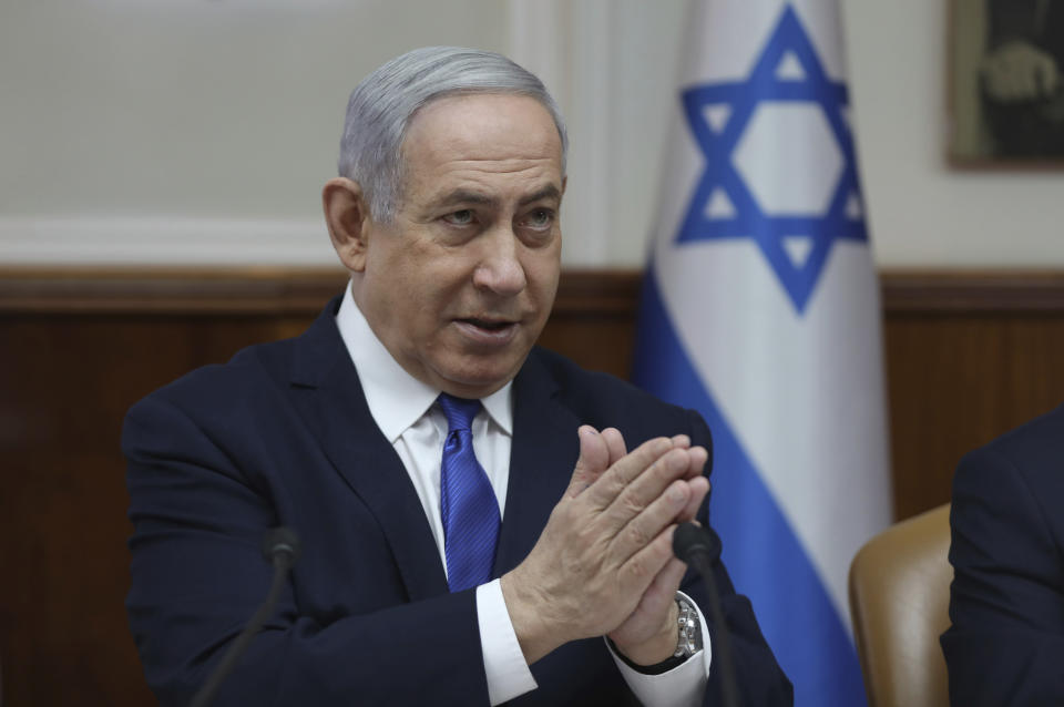 File - In this Sunday, Dec. 29, 2019 file photo, Israeli Prime Minister Benjamin Netanyahu attends the weekly cabinet meeting at his office in Jerusalem. Netanyahu said Monday that he would seek immunity from corruption charges, likely delaying any trial until after March elections, when he hopes to have a majority coalition that will shield him from prosecution. (Abir Sultan /Pool photo via AP, File)