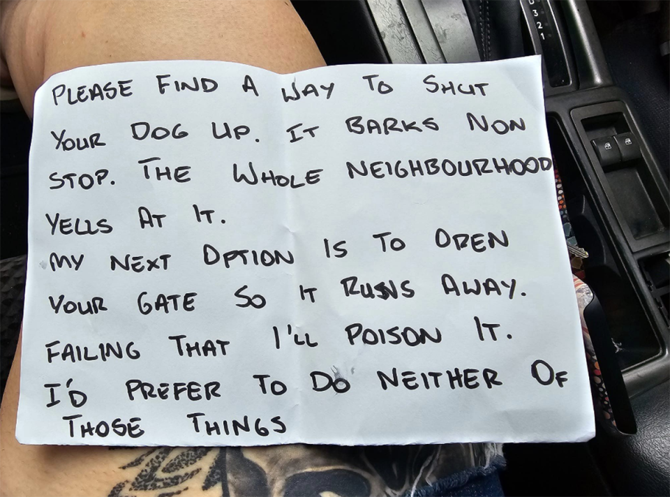 The handwritten note threatening the woman's dog in Townsville.