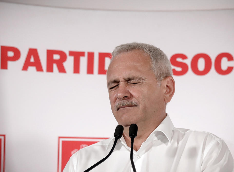 FILE- In this Sunday, May 26, 2019, file photo Liviu Dragnea, the head of the ruling Social Democratic party gestures during a press conference after exit polls were released after voting in the European Parliament elections, in Bucharest, Romania. The High Court for Cassation and Justice has sentenced Dragnea to serve 3 and a half years in prison for intervening from 2006-2012 to keep two women on the payroll of a family welfare agency, even though they were working for his party instead. (AP Photo/Vadim Ghirda, File)