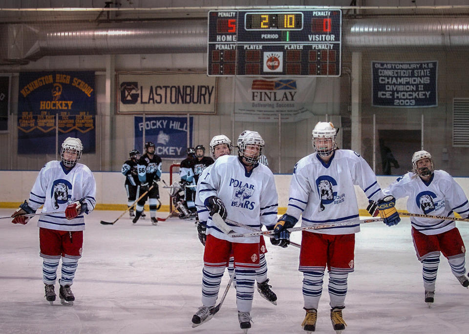 FILE - Members of the under-19 Connecticut Polar Bears hockey team skate together after scoring a goal on Dec. 28, 2005, in Newington, Conn. A Connecticut legislative committee has approved a bill on Thursday, March 10, 2022, calling for a study of youth sports safety including the use of hockey neck guards, in response to the death of a 10th grade hockey player. (AP Photo/Jessica Hill, File)