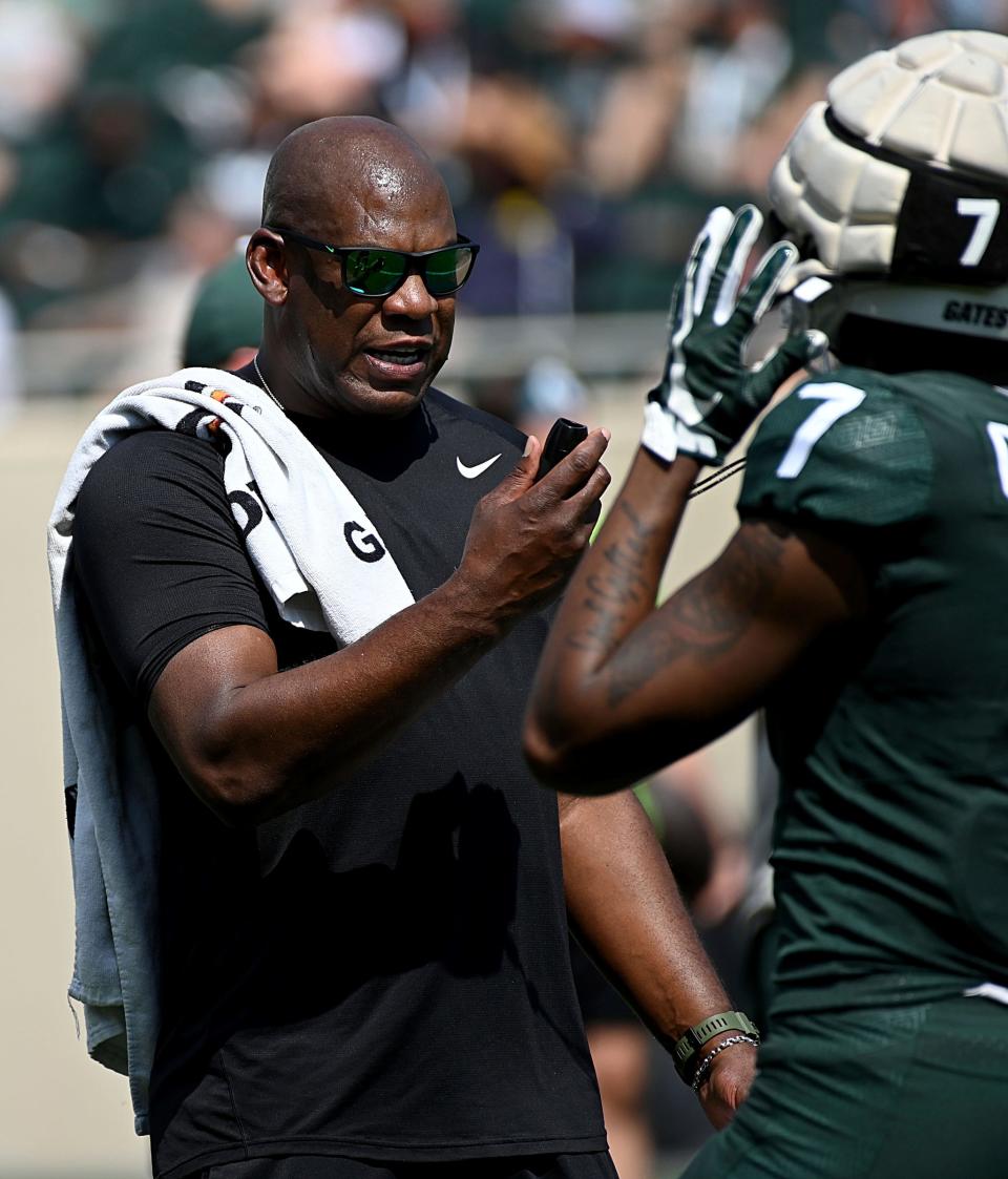 Apr 15, 2023; East Lansing, MI, USA; Michigan State Spartans head coach Mel Tucker talks with receiver Antonio Gates Jr. (7) during a scrimmage at Spartan Stadium.