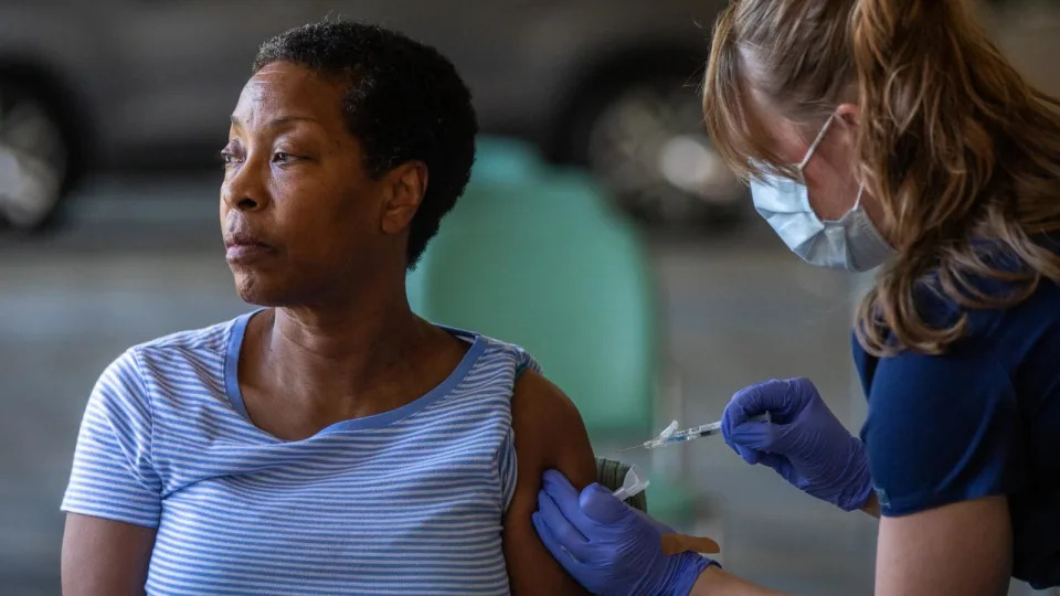 PHOTO: Denise Fractious, 68, of Pasadena, receives her COVID vaccine during a flu and COVID-19 vaccination clinic at Kaiser Permanente Pasadena on Oct. 12, 2023, in Pasadena, Calif. (Francine Orr/Los Angeles Times via Getty Images, FILE)