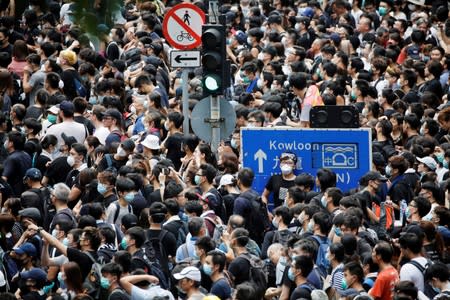 People protest outside police headquarters, demanding Hong Kong’s leaders to step down and withdraw the extradition bill, in Hong Kong