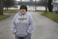 Rouie Hawkins, of Wabash, Ind., poses outside her union's meeting hall in Huntington, Ind., Tuesday, Dec. 6, 2016. Hawkins works at United Technologies Electronic Controls factory in Huntington where she met her husband, Ford. They're both still there but have a Plan B: He's making plans to start a used-car business and she's weighing whether to take advantage of the union's severance agreement for reimbursement toward up to four years of college. (AP Photo/Michael Conroy)