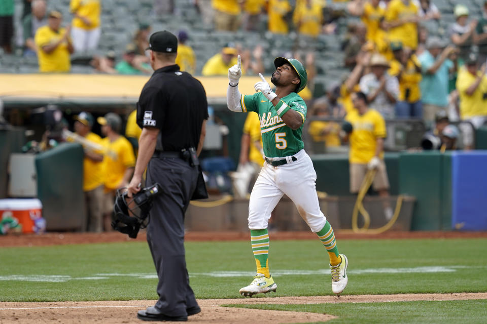 Oakland Athletics' Tony Kemp (5) celebrates after hitting a solo home run against the Chicago White Sox during the sixth inning of a baseball game in Oakland, Calif., Sunday, Sept. 11, 2022. (AP Photo/Godofredo A. Vásquez)